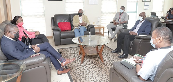Kobby Asmah (right), Editor of the Daily Graphic, explaining a point to Abena Osei Poku (2nd from left), Chief Executive Officer of Absa Bank Ghana, and Ebenezer Amankwah (left), Head of Corporate Communications, Absa Bank Ghana, during the meeting. Looking on are Ato Afful (3rd from left), Managing Director of Graphic Communications Group Limited (GCGL), and other officials of GCGL. Picture: EDNA SALVO-KOTEY